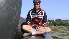 Tao finds a comfortable position on the Alexander Kielland Memorial that is out of the wind